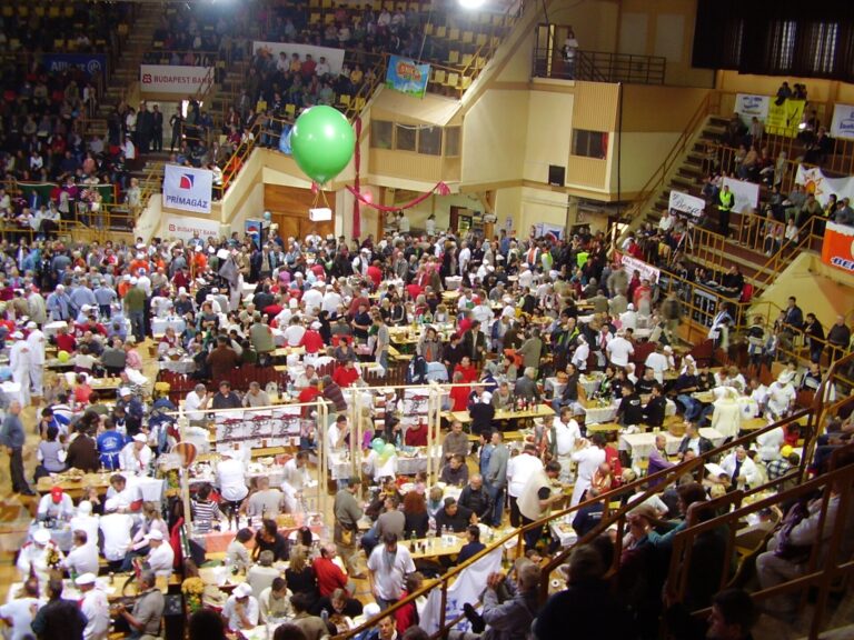 People making Hungarian sausage by hand at a festival
