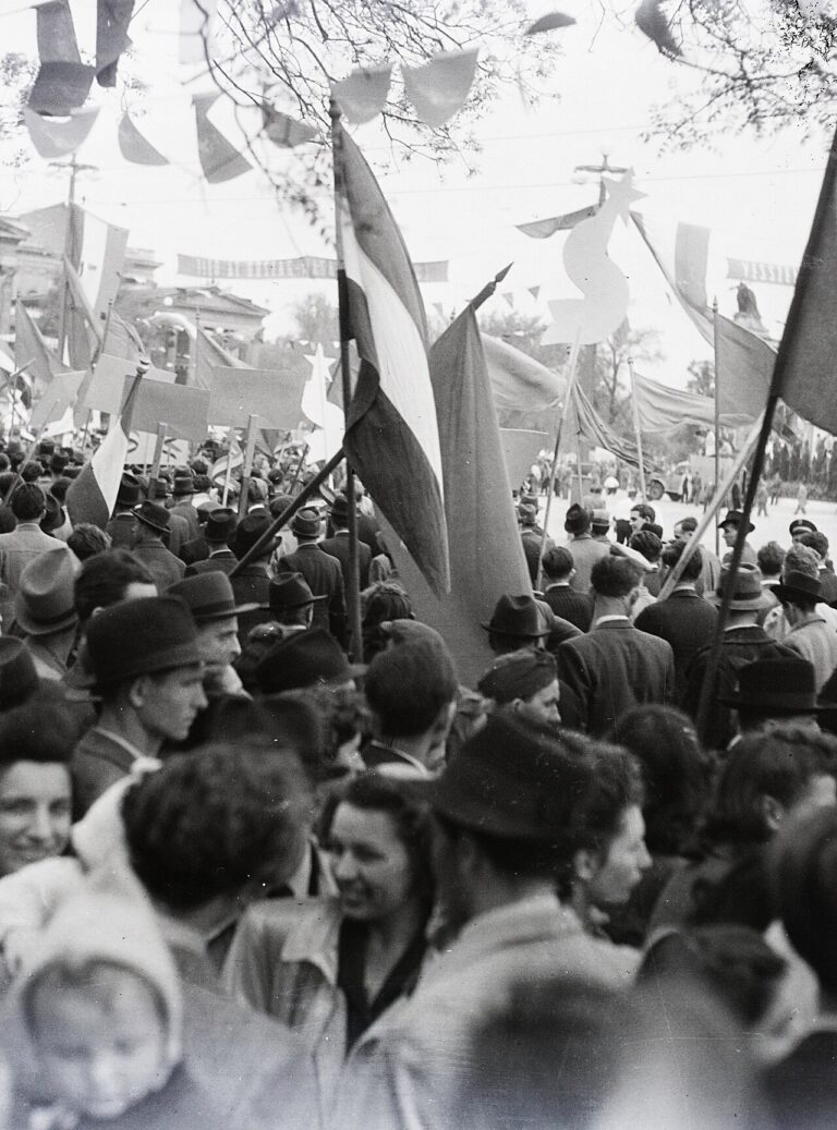 Crowds and banners at a 1948 May Day parade on Heroes Square in Budapest