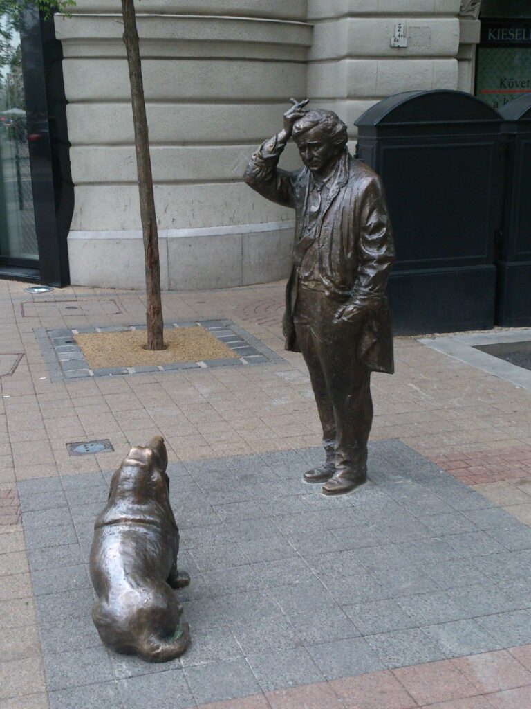 Bronze statue of Lieutenant Columbo with his dog on Falk Miksa street in Budapest
