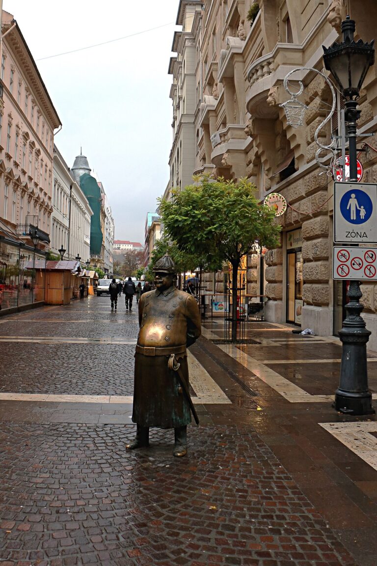 Bronze statue of a portly mustachioed policeman near St Stephens Basilica in Budapest