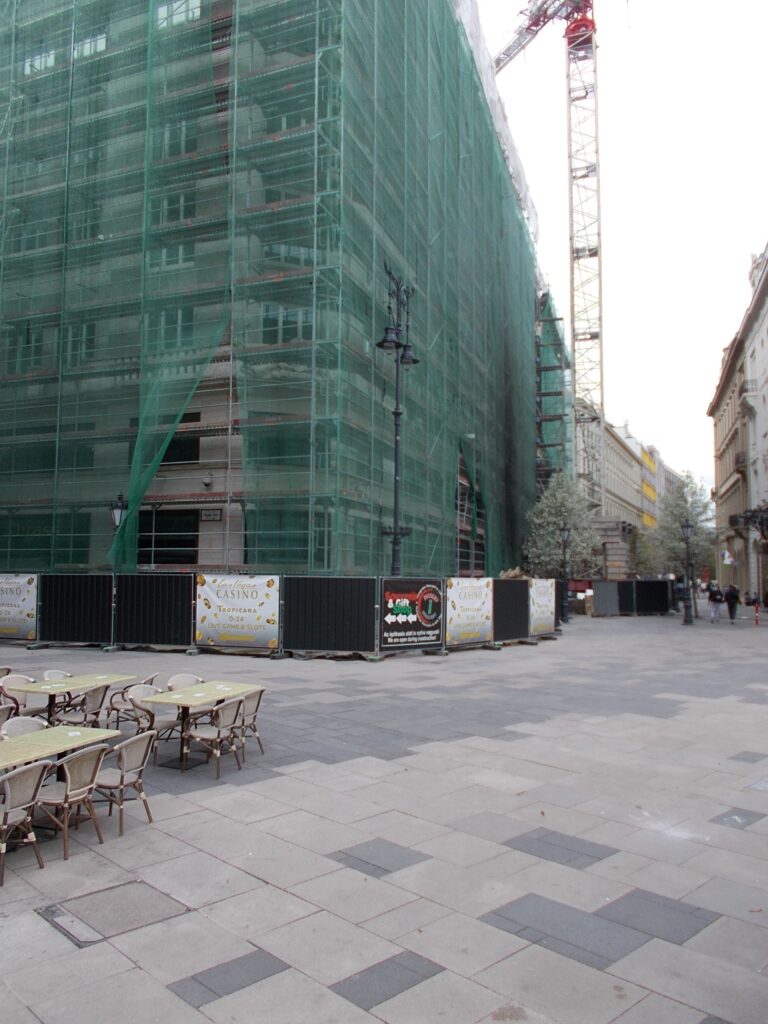 The modernist 1937 corner building at Dorottya utca 2 in Budapest covered in scaffolding during its conversion in March 2023